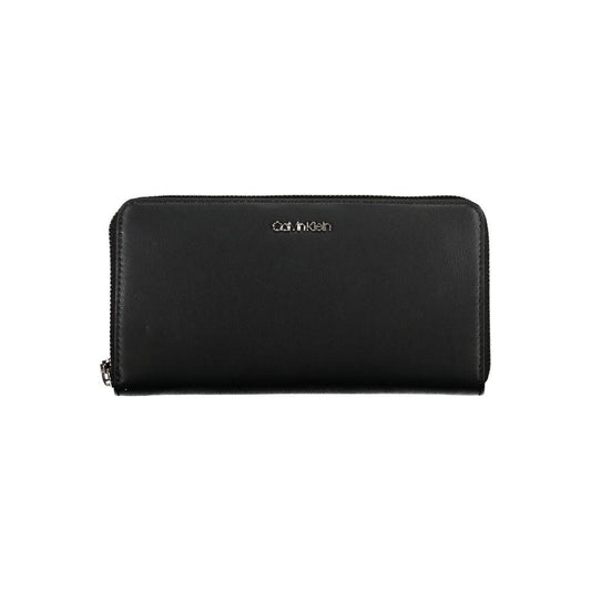 Calvin Klein black polyethylene wallet with zip closure, 5 compartments, coin purse, card slots, and removable pull, featuring logo.