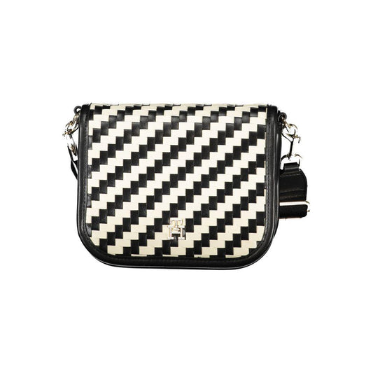 Black and white geometric-patterned handbag with adjustable strap and branded logo accent.