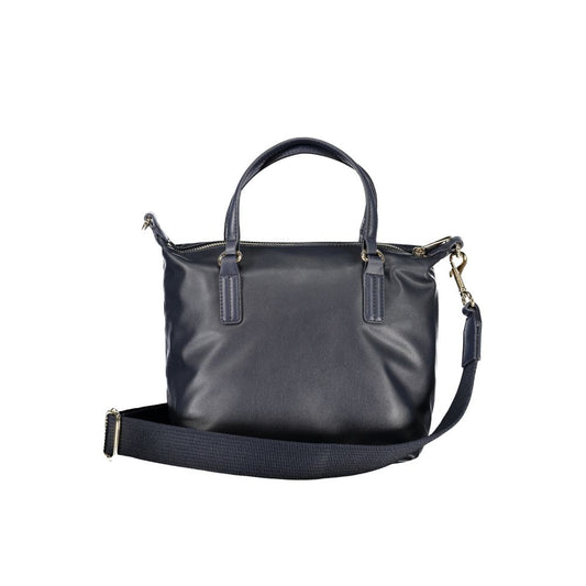 Tommy Hilfiger blue polyester handbag with two handles, adjustable shoulder strap, internal pocket, zip closure, and logo.