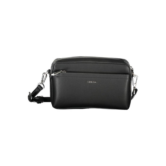 Calvin Klein black polyester women's handbag with adjustable strap and removable shoulder handle, urban chic design.