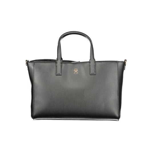 Tommy Hilfiger black polyester handbag with two handles and a removable strap, featuring spacious compartments and stylish design.