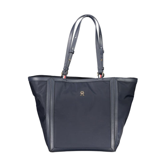 Tommy Hilfiger blue polyester handbag with adjustable shoulder handles, internal pockets, zip closure, and logo.