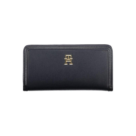 Tommy Hilfiger blue polyethylene wallet with logo, four compartments, external pocket, card slots, snap closure.