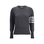 Thom Browne Virgin wool Sweater featuring ribbed cuffs and iconic horizontal bands on a dark grey background.