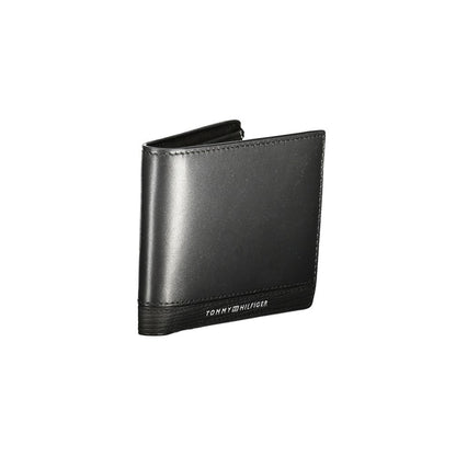 Tommy Hilfiger Black Leather Men Wallet with logo, coin purse, card slots, and contrasting details for stylish essentials.