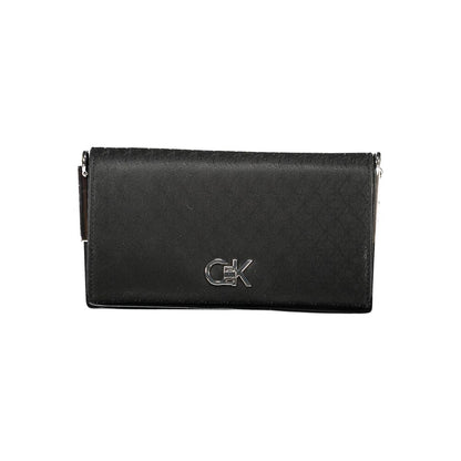 Calvin Klein Black Polyester Women Handbag with logo on front, stylish design, versatile accessory.