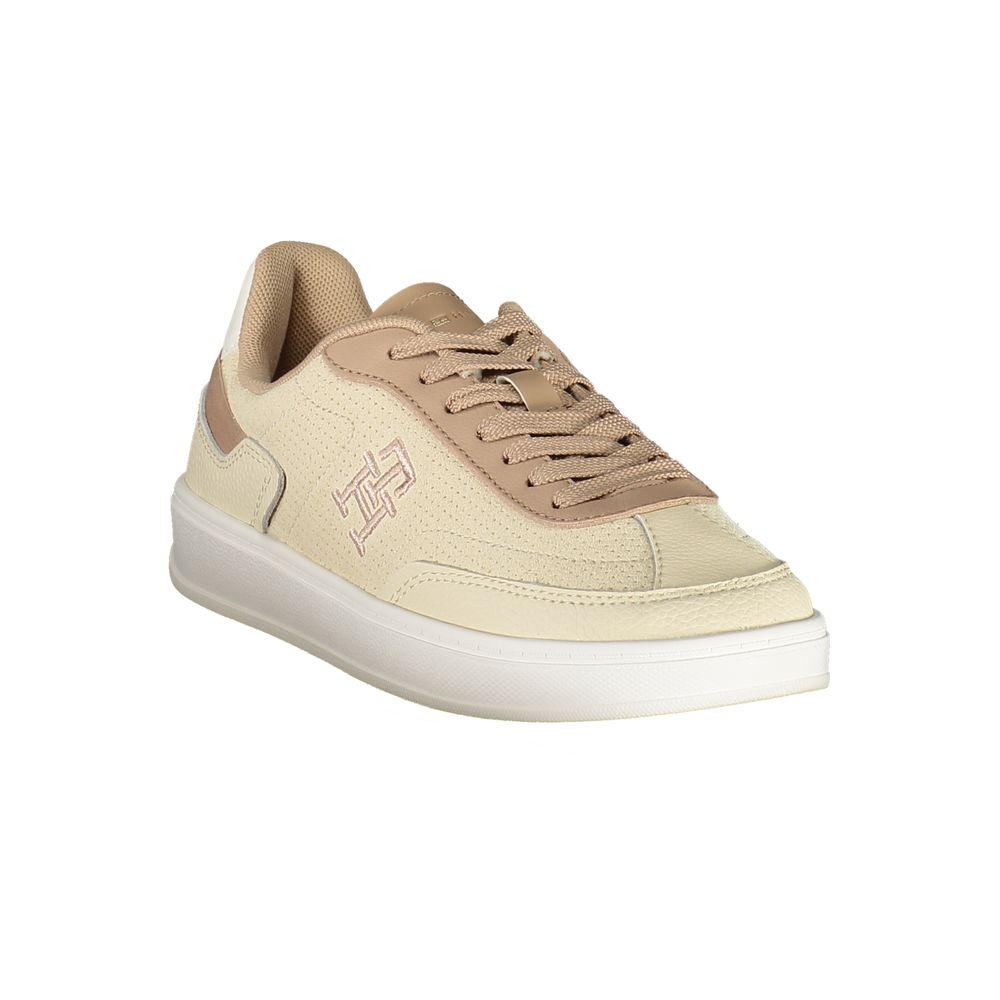 Tommy Hilfiger Beige Leather Women Sneaker with contrast details and iconic logo embroidery on white sole.