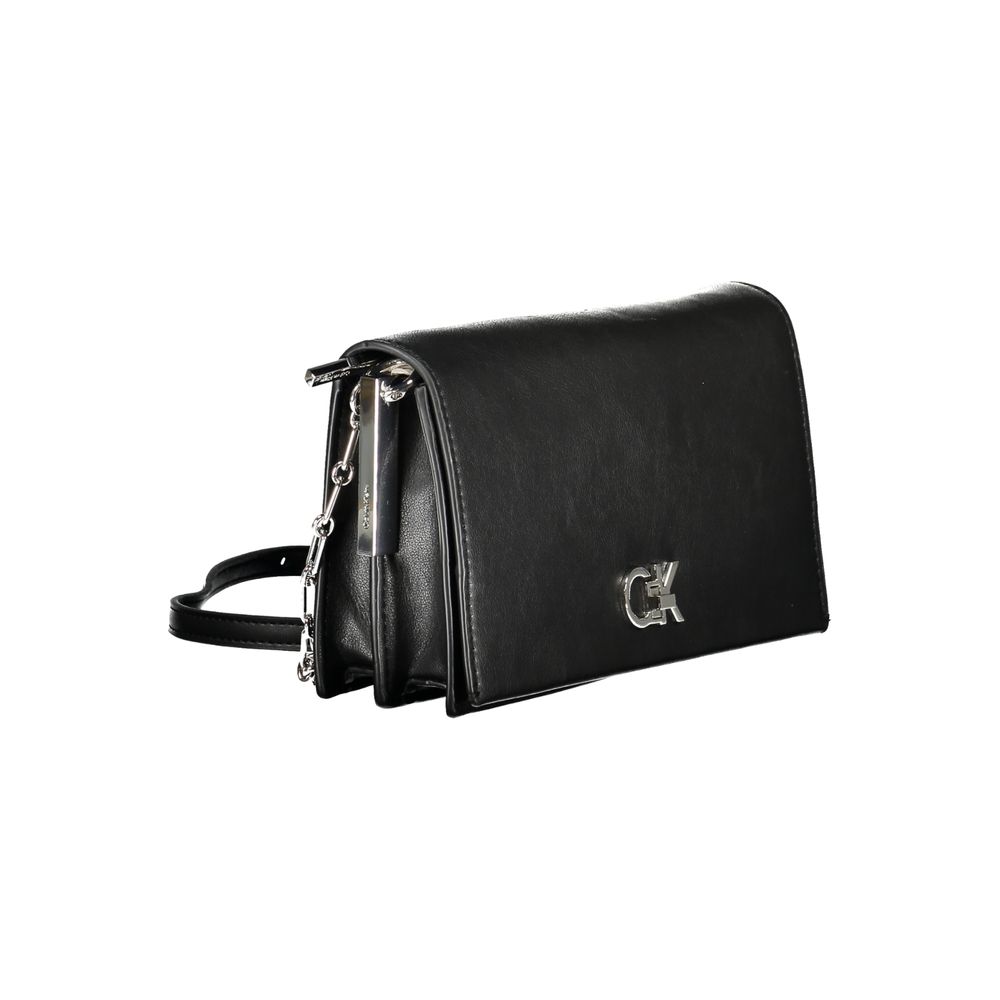 Calvin Klein Black Polyester Handbag with adjustable strap, two compartments, twist closure, and logo accent.