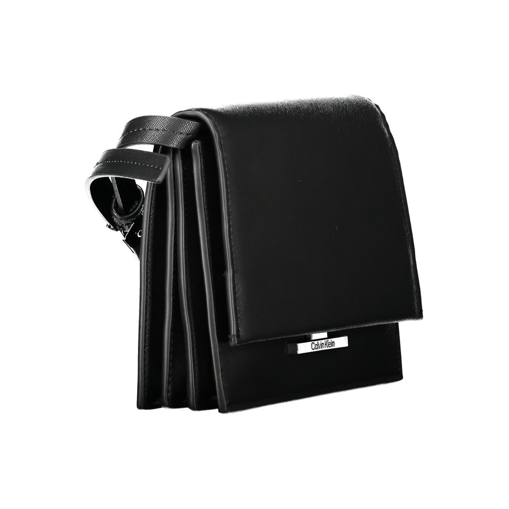 Calvin Klein Black Polyethylene Handbag with adjustable shoulder strap, 3 compartments, internal pocket, and snap closure.