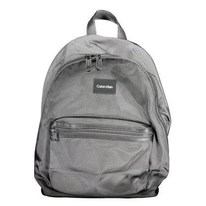 Calvin Klein Black Polyester Backpack with adjustable straps, external and internal pockets, laptop compartment, and water-repellent finish.