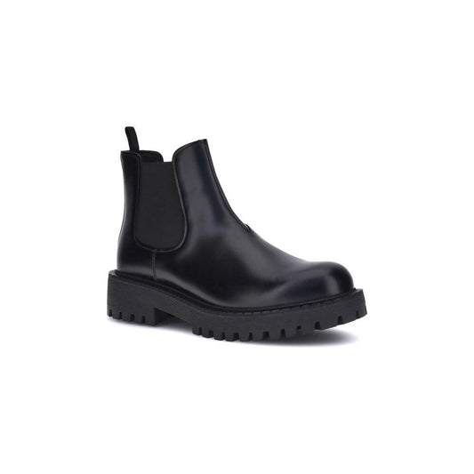 Black rubber boot on a white background
