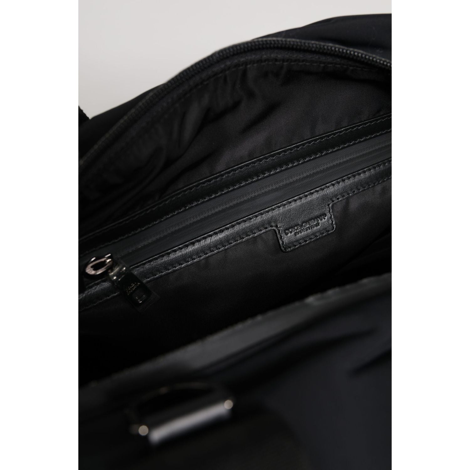Front view with bag zipped and handles upright.