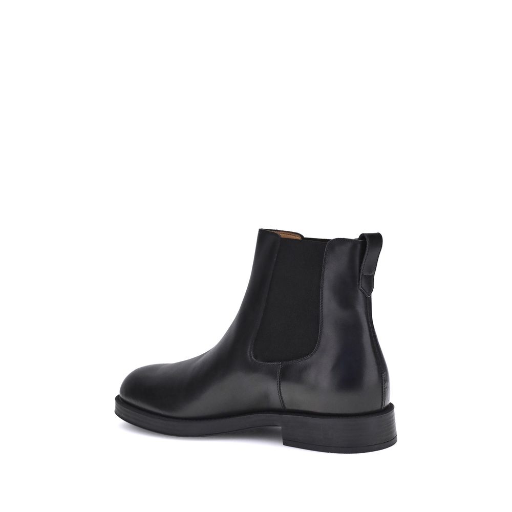 Tod's Black Calf Leather Bos Taurus Chelsea Boots with matte finish and elastic side
