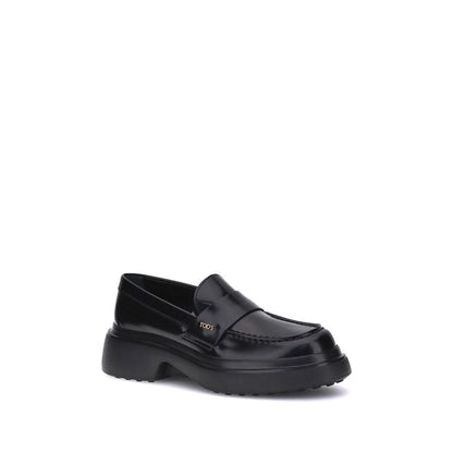 Tod's Black Rubber Platform Loafers with patent leather and rounded toe, featuring side logo plaque and rubber sole for comfort and style.