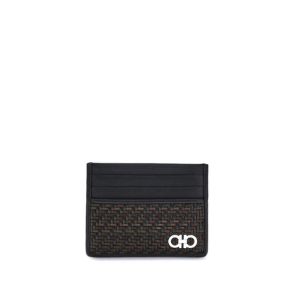 Ferragamo Black Calf Leather Bos Taurus Wallet with Gancini ornament and woven design.