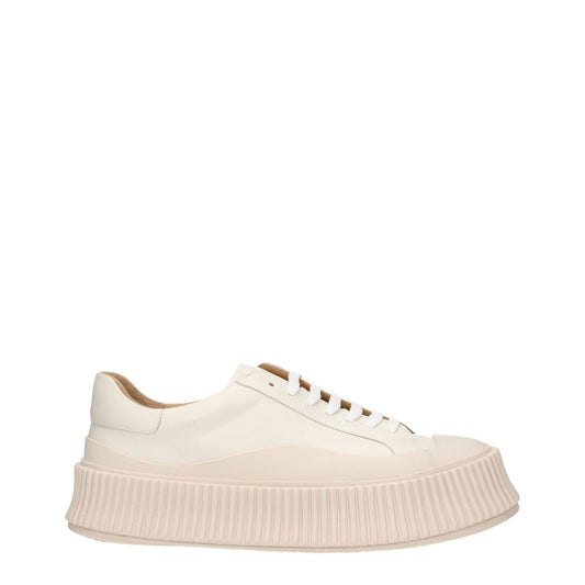 Jil Sander Beige Leather Platform Sneakers with aged effect, lace-up closure, and 5 cm rubber wedge sole. Casual style with round toe design.