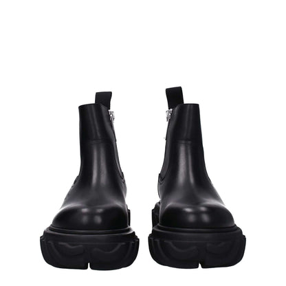 Off-White Black Leather Ankle Boots with zip closure and side logo, featuring rubber sole, mid heels, and round toe design.
