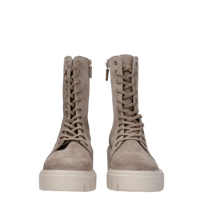 Stuart Weitzman Beige Leather Ankle Boots with lace-up closure, mid heels, and rubber sole. Suede material, vintage style.