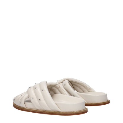 Fabiana Filippi Beige Leather Slippers with open toe, stud details, and low flat heel, featuring a rubber sole in ivory and beige.
