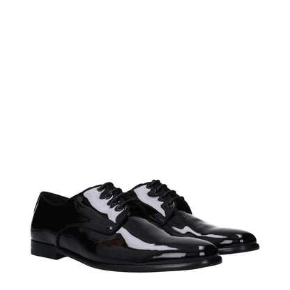 Dolce & Gabbana Black Leather Oxfords And Derbies lace-up shoes with patent finish, pointy toe, low flat heel, and leather sole.