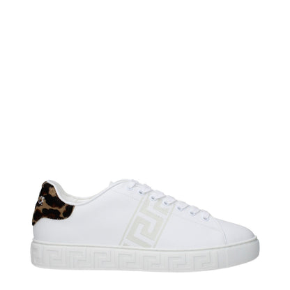 Versace White Leather Low Top Sneakers with logo details, lace-up closure, and rubber sole featuring a round toe design.