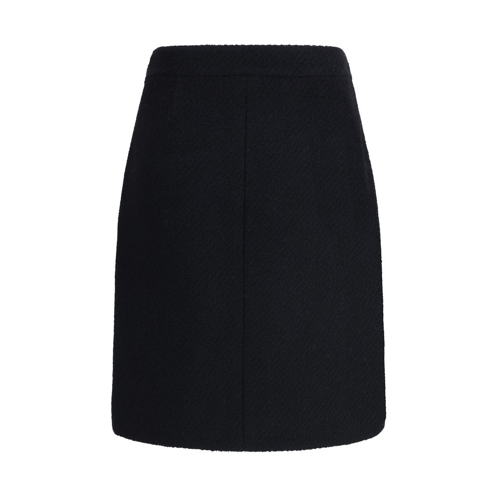 Chloé Black Wool Midi Skirt with bouclé texture, front flap pockets, and gold-tone buttons, perfect for a regular fit and elegant AW25 style.