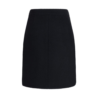 Chloé Black Wool Midi Skirt with bouclé texture, front flap pockets, and gold-tone buttons, perfect for a regular fit and elegant AW25 style.