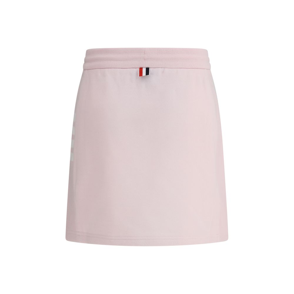 Thom Browne Multicolor Cotton Mini Skirt with drawstring waistband and logo patch, showcasing front slits and signature side bands.