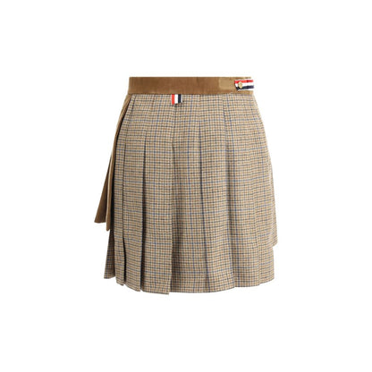 Thom Browne Brown Wool Mini Skirt with pleated design, houndstooth velvet layers, iconic stripe band, and button closure.