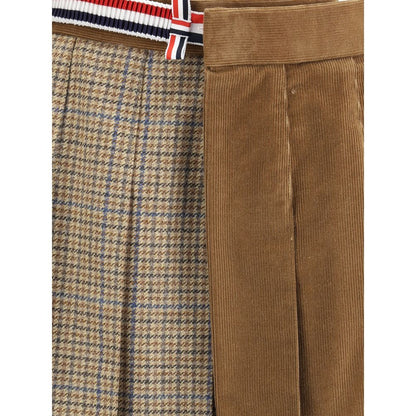 Close-up of Thom Browne Brown Wool Mini Skirt with houndstooth pattern, velvet texture, and striped side band, showcasing stylish detail.