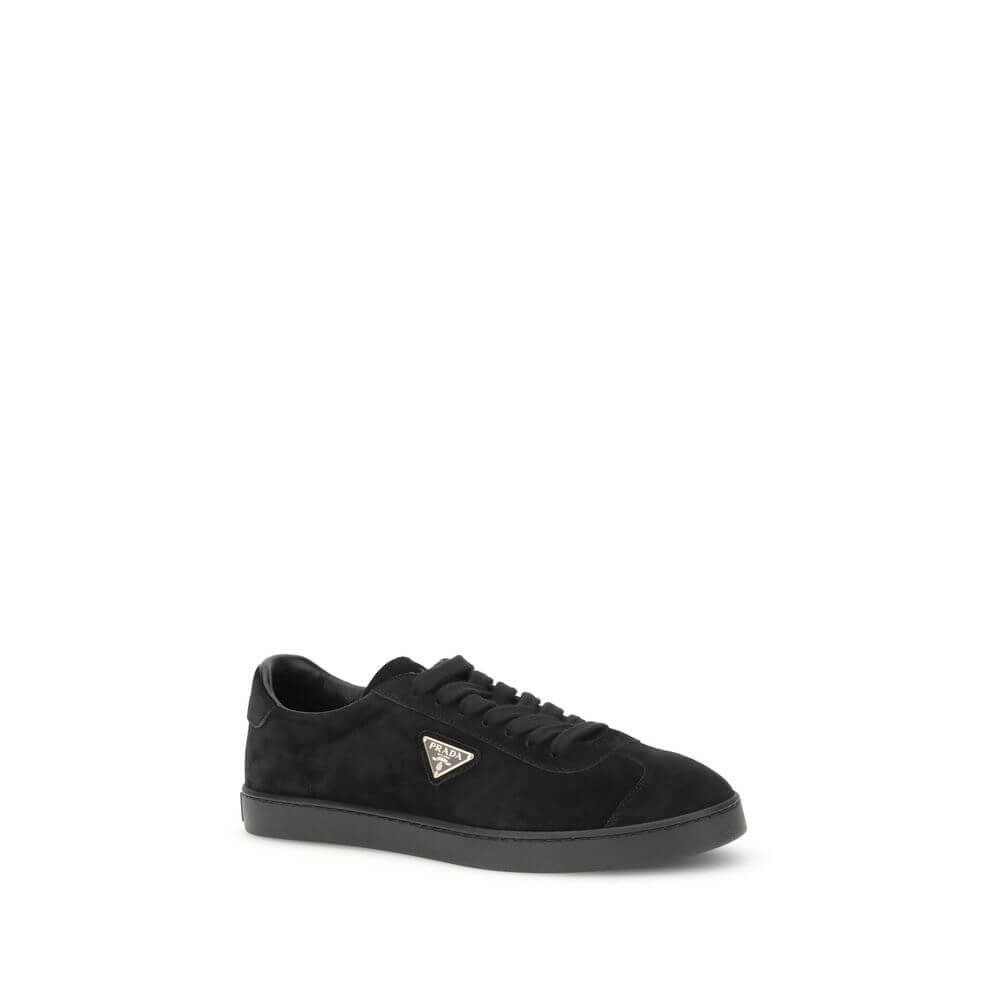 Prada Black Calf Leather Bos Taurus Low Top Sneakers with triangular plaque and logo on rubber sole.