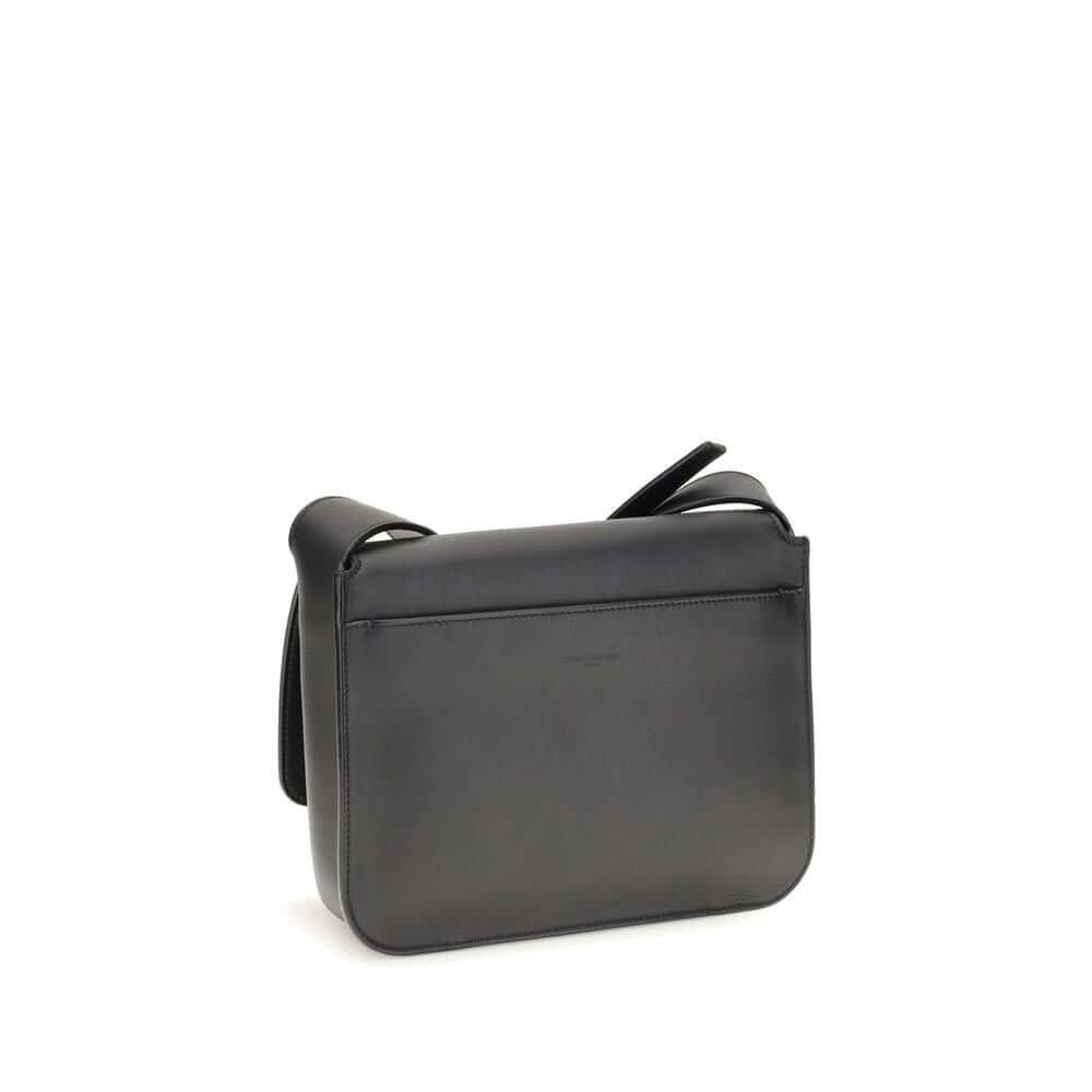 Back view of Saint Laurent Black Calf Leather Bos Taurus Shoulder Bag with adjustable strap and sleek design.
