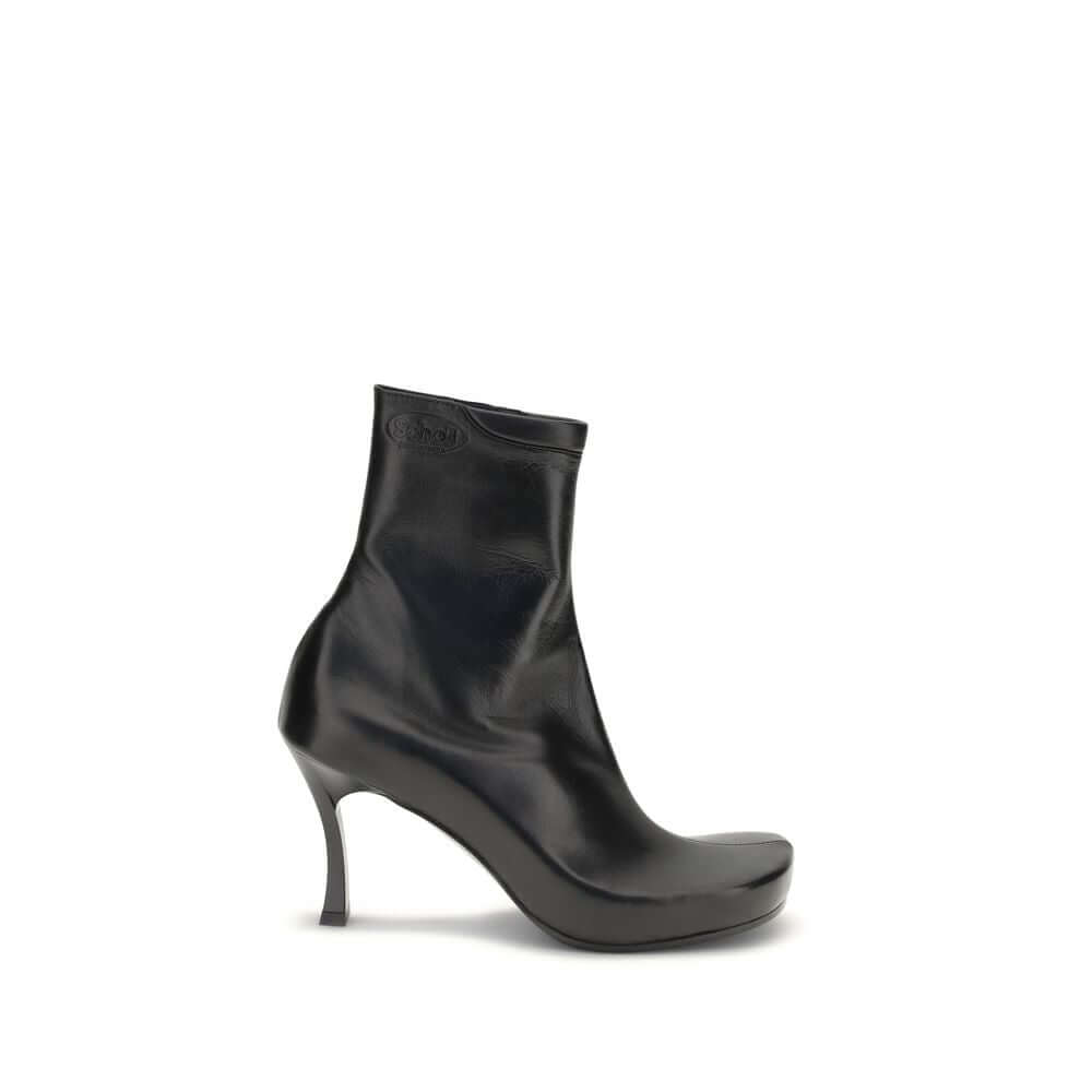 Balenciaga Black Calf Leather Bos Taurus Ankle Boots featuring ergonomic insole and embossed logos, side view.