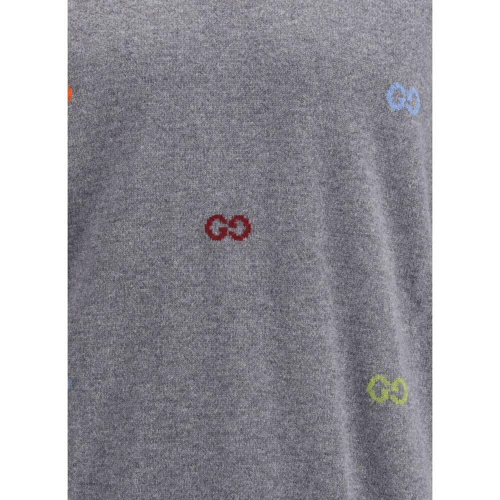 Close-up of Gucci Gray Cashmere Sweatshirt featuring multicolor jacquard logo and ribbed detailing. Made from 100% Kashmir.