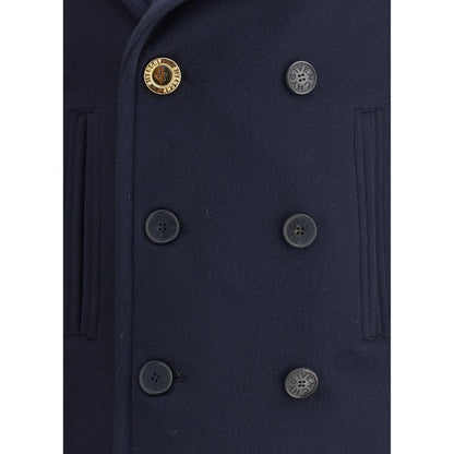 Givenchy Blue Wool Coat with double-breasted buttons and wide lapels, detailed view of front button closure and welt pockets.