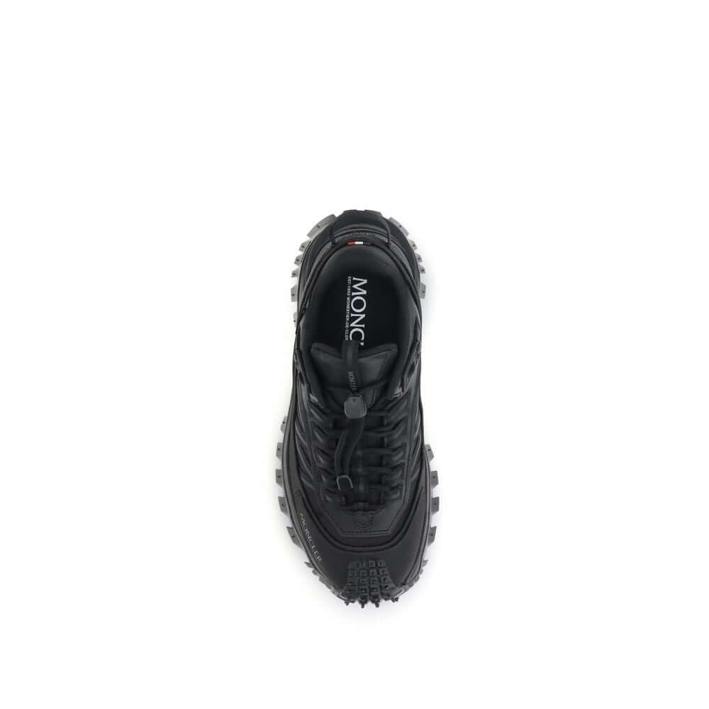 Top view of Moncler Black Calf Leather Bos Taurus Athletic Sneakers with drawstring closure and padded tongue for comfort.