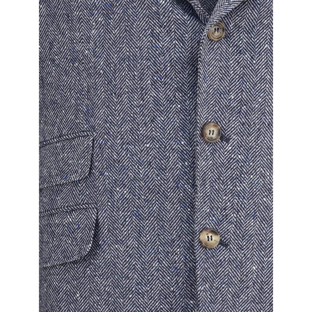 Close-up of Brunello Cucinelli Blue Wool Blazer showing herringbone pattern, buttons, and pocket details for AW25 collection.