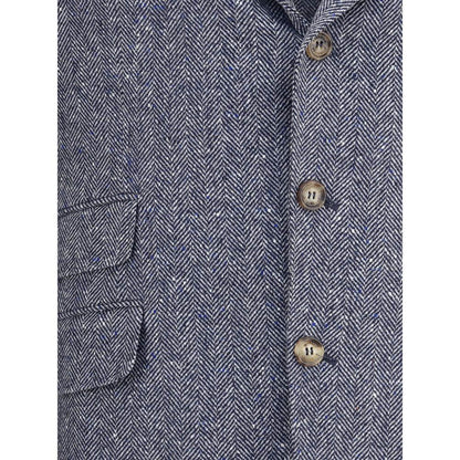 Close-up of Brunello Cucinelli Blue Wool Blazer showing herringbone pattern, buttons, and pocket details for AW25 collection.