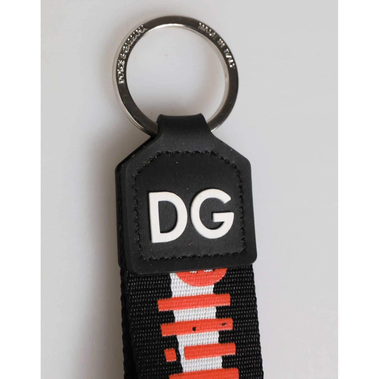 Dolce & Gabbana Black Red Logo Polyester Brass Holder Keychain Keyring with silver brass ring and DG logo on red strap.