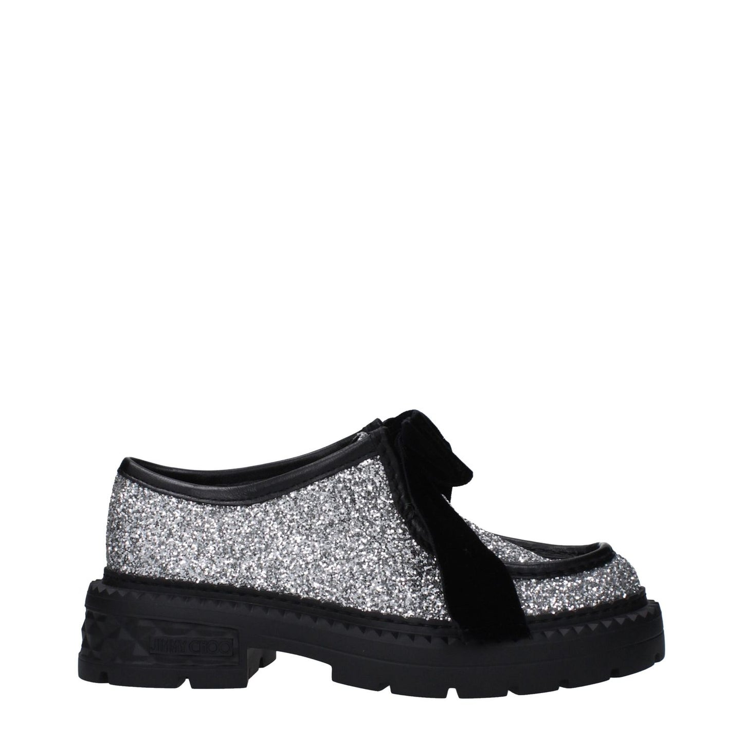 Jimmy Choo Gray Plastic Slip-On Loafers with glitter, black mid heel, rubber sole, and round toe, featuring punk rock style and side logo.