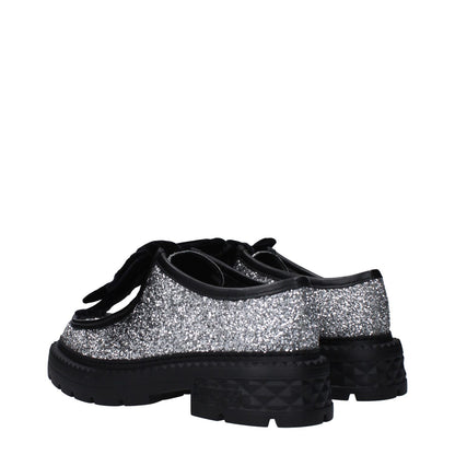 Jimmy Choo Gray Plastic Slip-On Loafers with glitter, round toe, mid heels, side logo, rubber sole, and punk rock style.