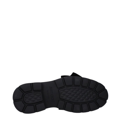 Sole view of Jimmy Choo Gray Plastic Slip-On Loafers with rubber sole and mid heels.