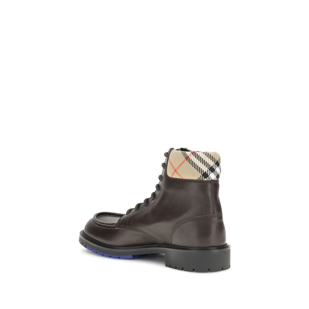Burberry Brown Calf Leather Bos Taurus Lace-Up Boots with padded Burberry Check collar, rugged silhouette, and embossed Equestrian Knight design.
