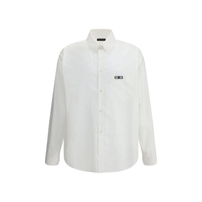 Balenciaga White Cotton Dress Shirt with classic collar and asymmetrical hem, featuring an embroidered logo and front button closure.