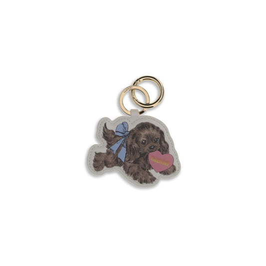 Ganni Multicolor Recycled Leather Keychain shaped like a dog with blue bow and pink heart, featuring a gold ring and clasp for easy attachment.