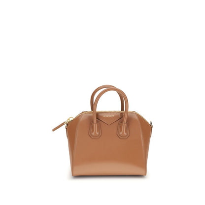 Givenchy Brown Calf Leather Bos Taurus Handbag with geometric design, shiny leather, top handles, and adjustable strap, featuring monogram.
