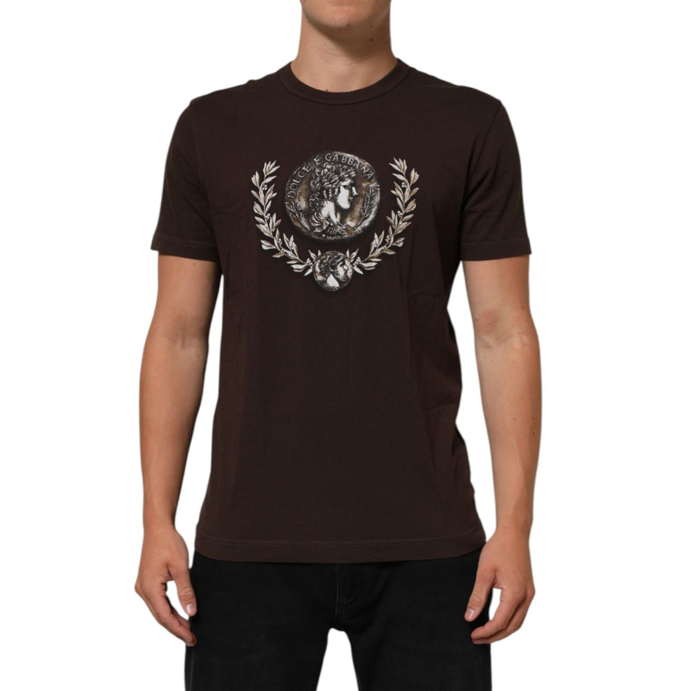 Man wearing Dolce & Gabbana Brown Coin Laurel Print Men Crew Neck T-shirt with intricate design, short sleeves, and regular fit.