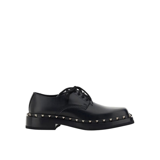 Valentino Garavani Black Calfskin Oxfords And Derbies with stud detail and lace-up closure for men.