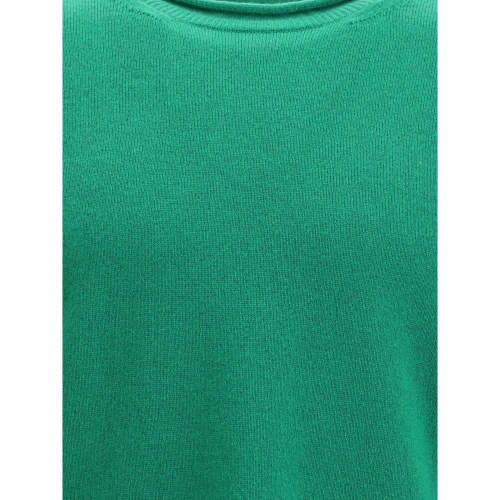 Comme Des Garçons Green Wool Sweatshirt with ribbed knit texture, round neckline, and long sleeves, ideal for elegant everyday wear AW25.