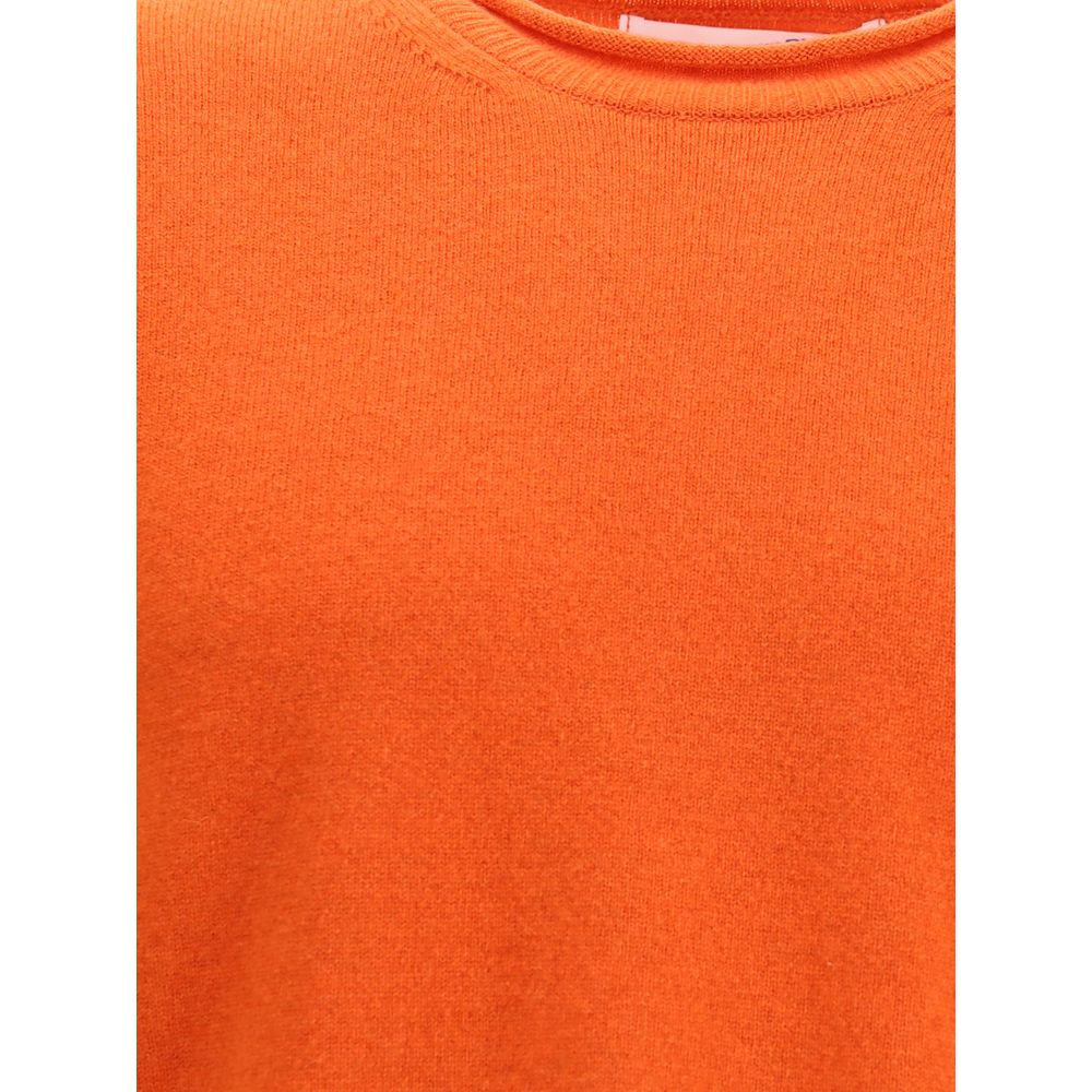 Close-up of the Comme Des Garçons Orange Wool Sweatshirt showcasing ribbed texture and round neckline.
